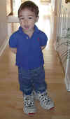 Max wearing daddy's sneakers; 4/28/03