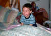 Max on Bubby&Poppop's bed; 06/21/03