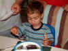 Max eating his birthday cake; 06/21/03